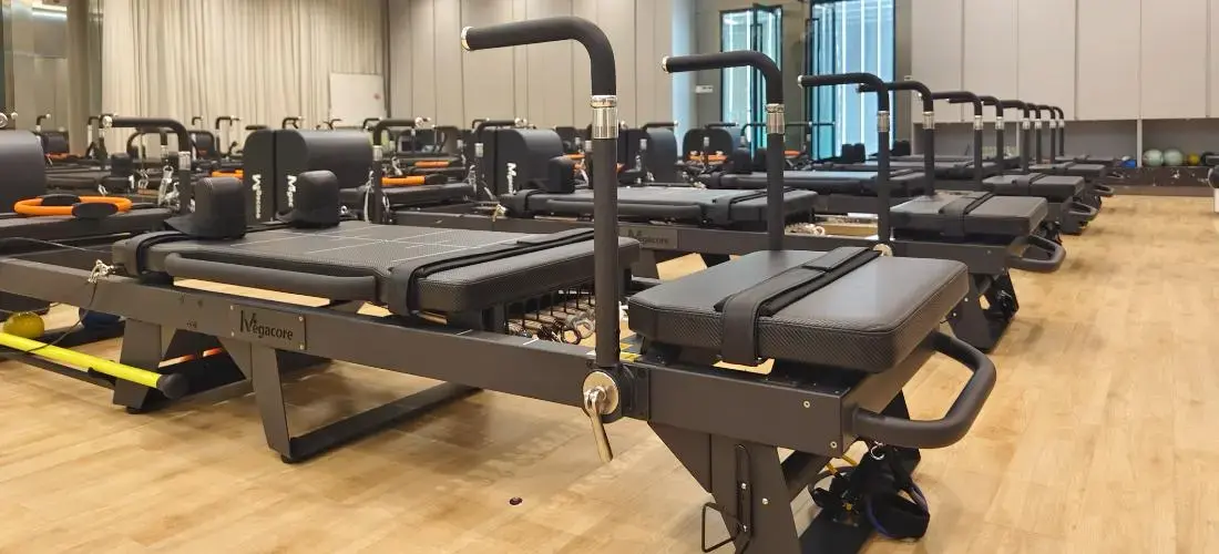 Premium Pilates reformer in modern studio setting - Megacore factory direct manufacturer